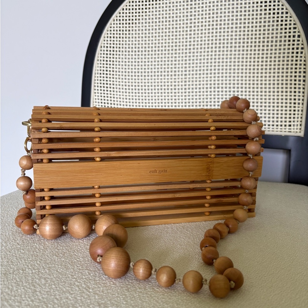 CULT GAIA wooden bamboo cage clutch with beaded strap